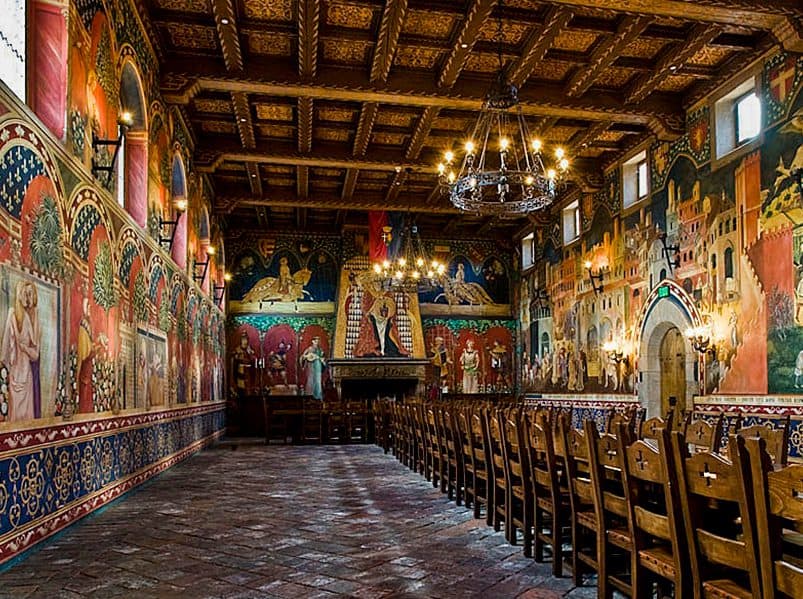 frescos on the wall of a great hall in a castle