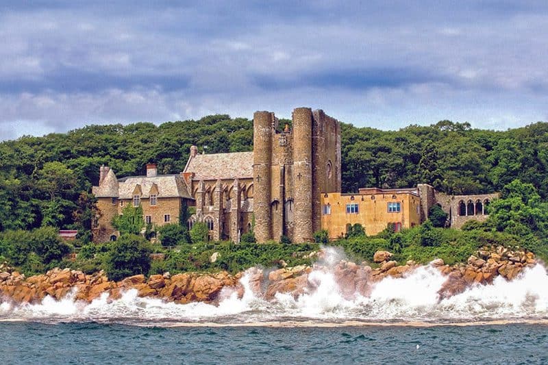 waves splashing along the shoreline by one of several castles in the USA