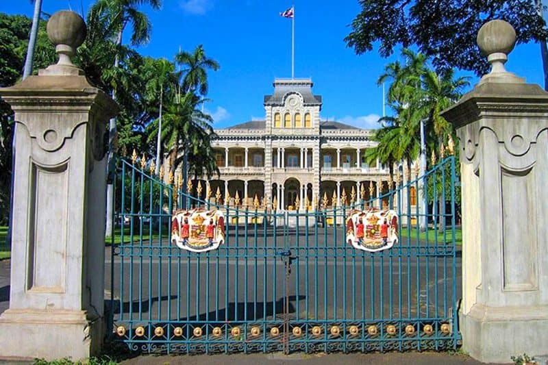 the front gate of a large ornate building