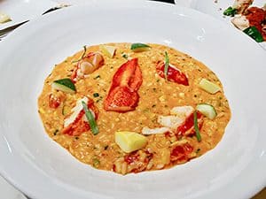 risotto with tomatoes on a plate in a restaurant
