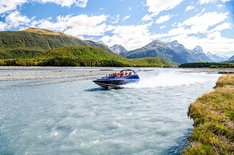 people taking tours in New Zealand on a jet boat