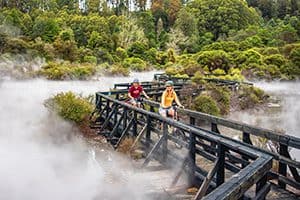 two young women on bicycle near thermal, on the tours in New Zealand