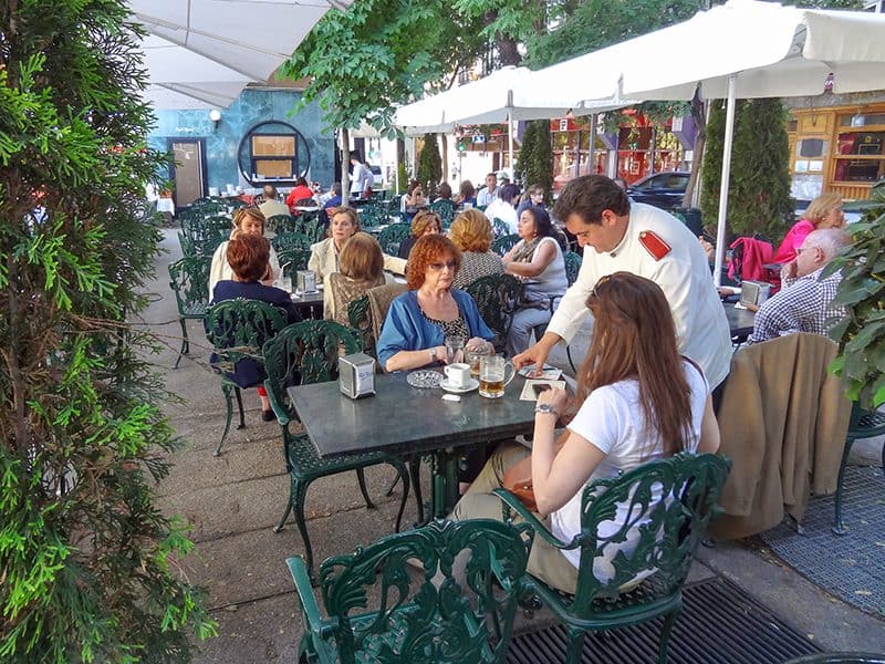 people having lunch in an outdoor cafe