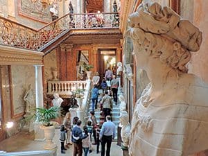 people walking through a museum