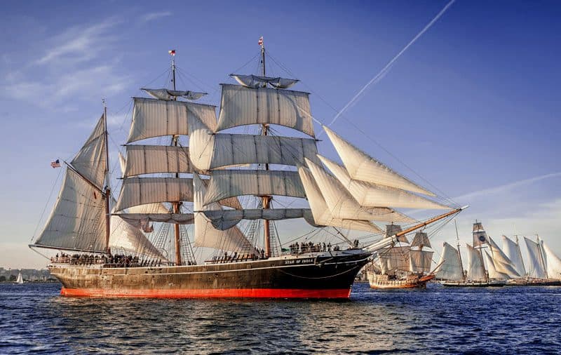 a large sailing ship with many people on its deck