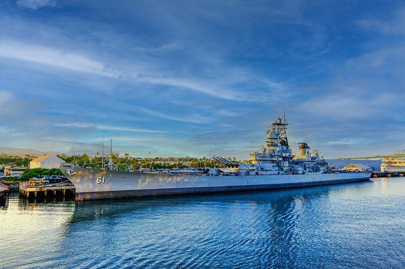 a very long battleship at its pier