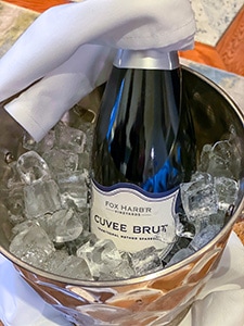a bottle of Champagne in an ice bucket