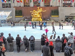 people on a skating rink in New York City in the low season in Europe