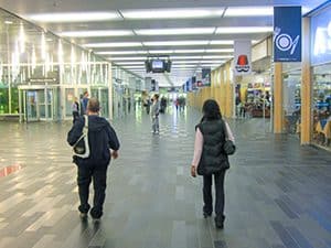 people walking through a large underground area