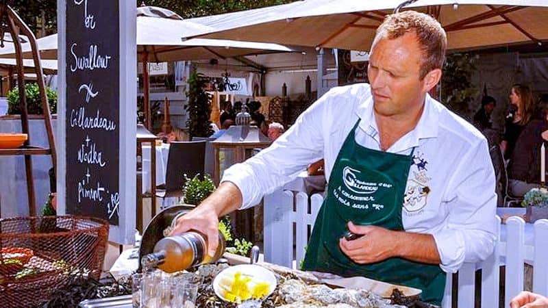 a bartender preparing a drink at one of the food festivals in Europe in 2023