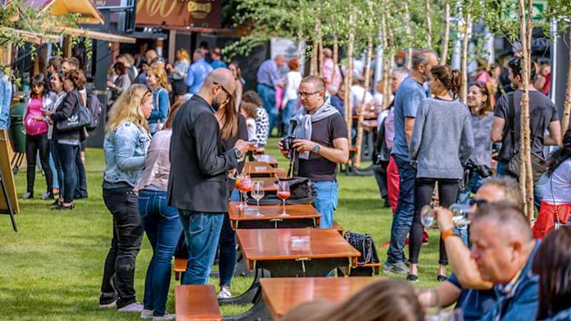 a large group of people at outdoor tables