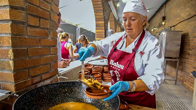 A female chef preparing a meal