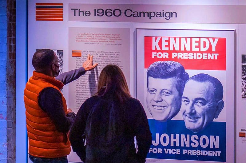 people looking at an exhibit in the presidential museum of JFK