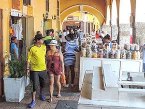 people walking along a crowded walkway in Cartagena Colombia