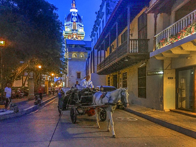 a horse and carriage in the evening in Cartagena Colombia