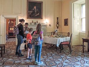 a family in a room on a tour