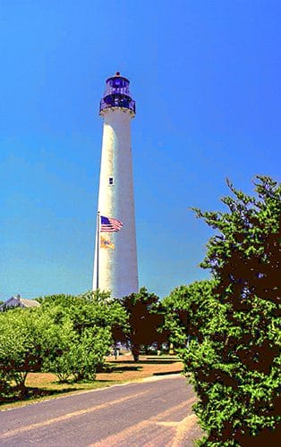 one of the tall U.S. lighthouses built alongside a highway 