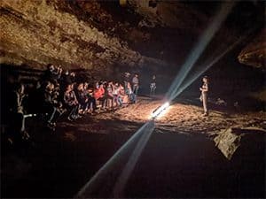 a park ranger giving a presentation in a cave in Mammoth Cave, one of the World Heritage sites in the USA