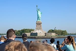 people looking at teh Statue of Liberty, one of the World Heritage sites in the USA