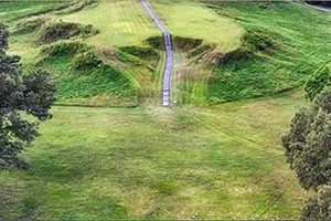 a walkway going up a large hill