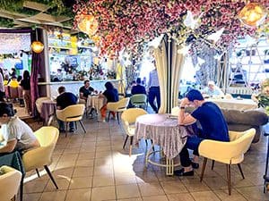 people sitting in an ornate restauarant, seen on a visit to almaty kazakhstan