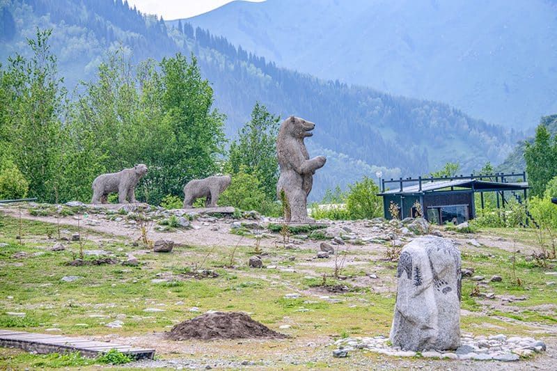 statues of bears in the woods