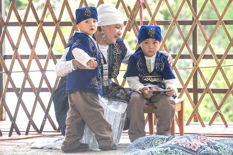 2 young boys with blue hats and jackets