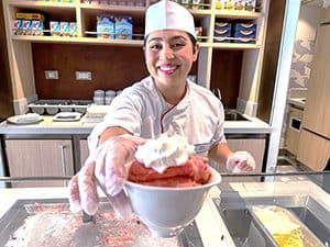 a woman serving ice cream