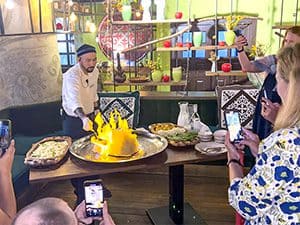 a chef flambeing a dish, seen on a visit to almaty kazakhstan