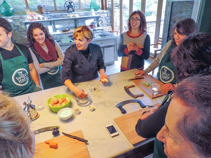 people standing around a table in a Florence cooking class