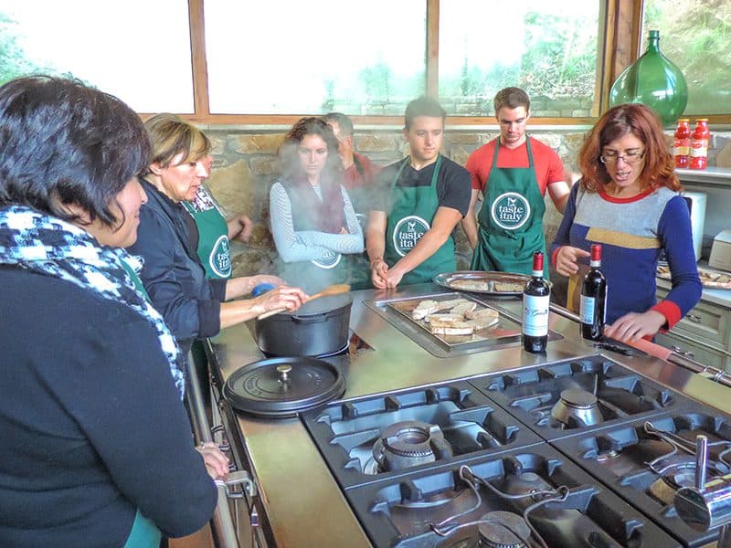 people watching food be prepared in a Florence cooking class