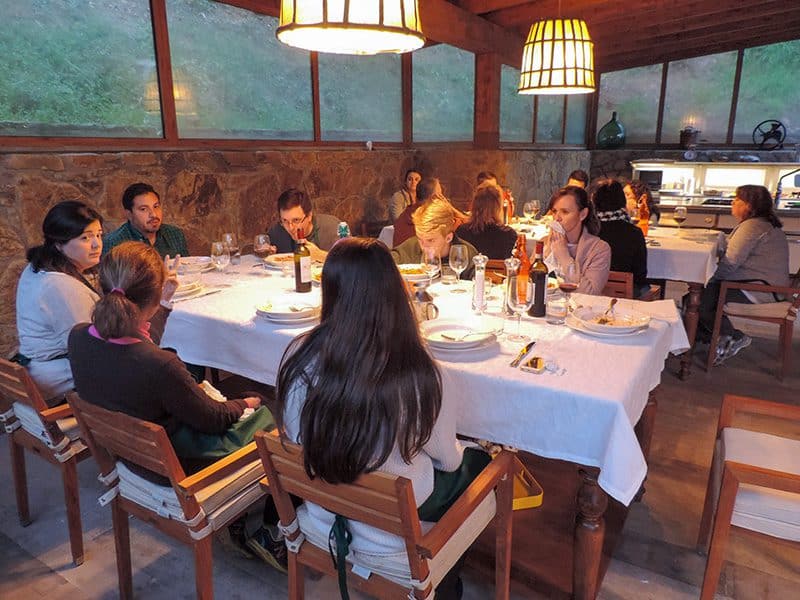 people sitting at tables in a Florence cooking class