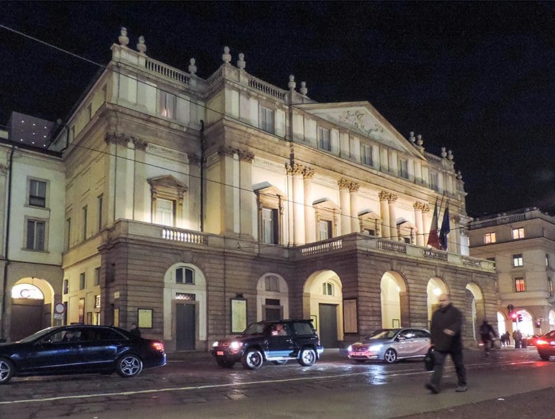 what to do in Milan - people outside an ornate theater at night