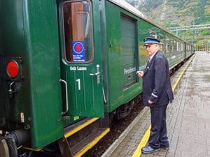 A train conductor boarding the Flam Railway