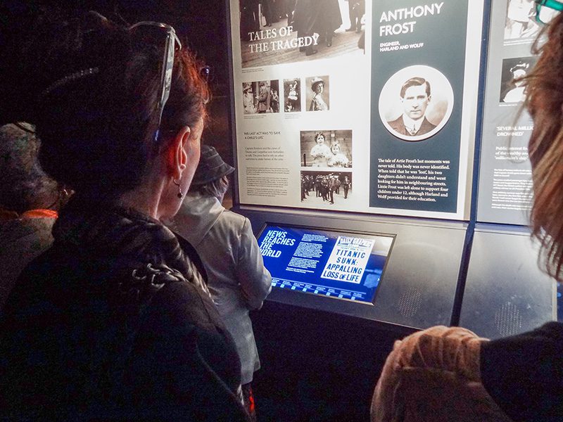 several women looking at an exhibit on the sinking of the Titanic