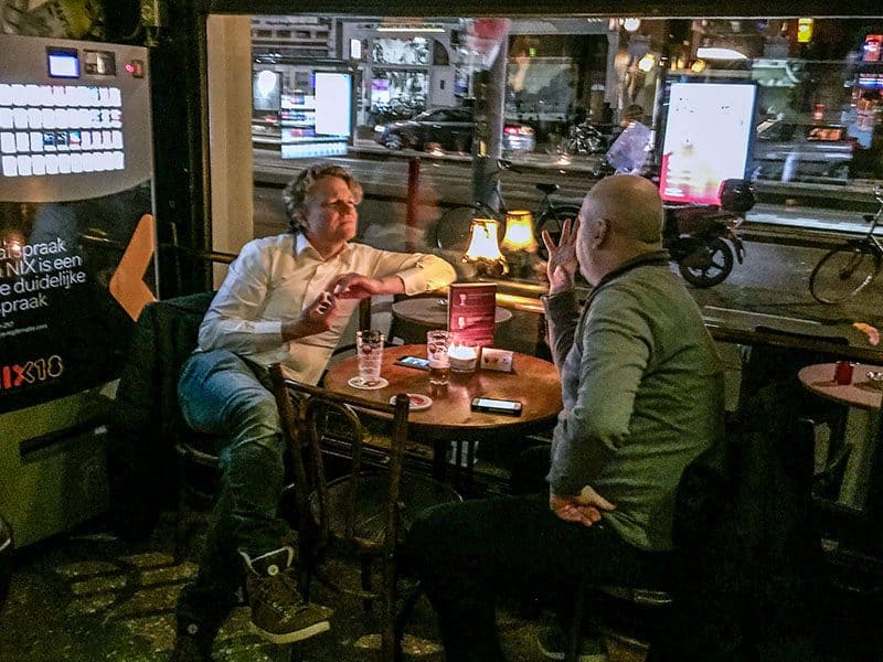 two men conversing in a pub in one of the hidden gems in Europe
