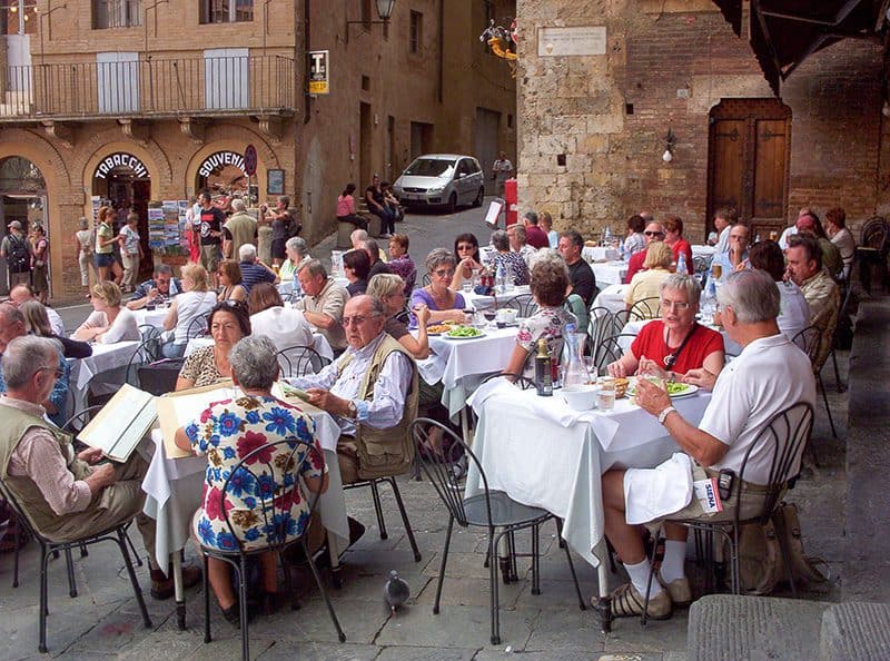 people at an outdoor restaurant inone of the Italian hill towns