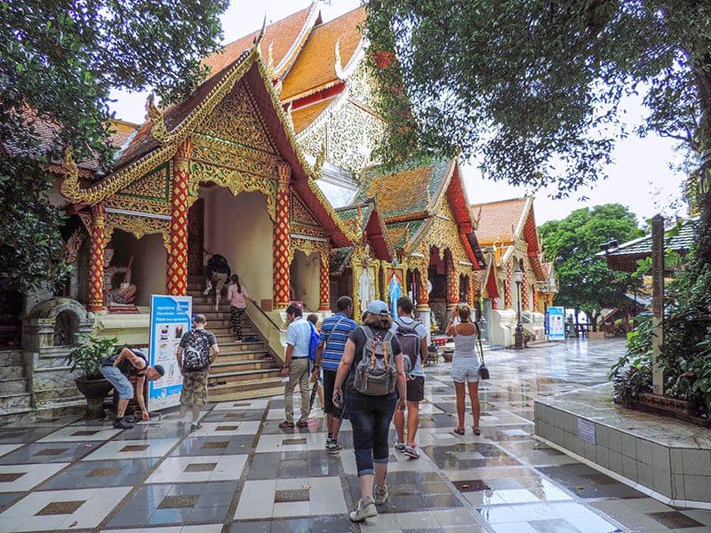 people visiting an ornate temple, one of the things to do in chiang mai