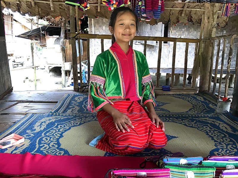 a tribal woman in a colorful dress