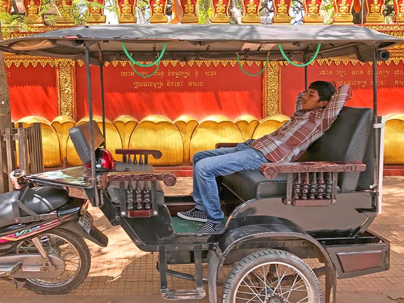 a taki driver taking a nap in his carriage