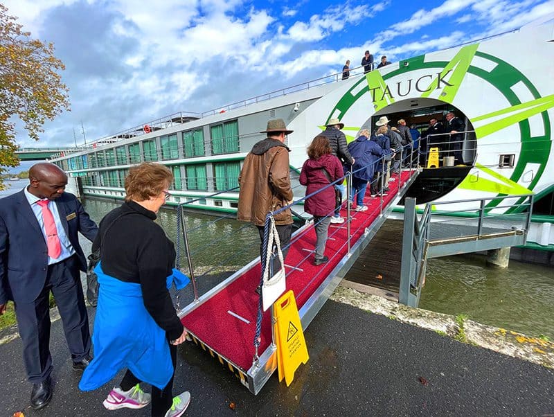 people boarding a Tauck river cruise