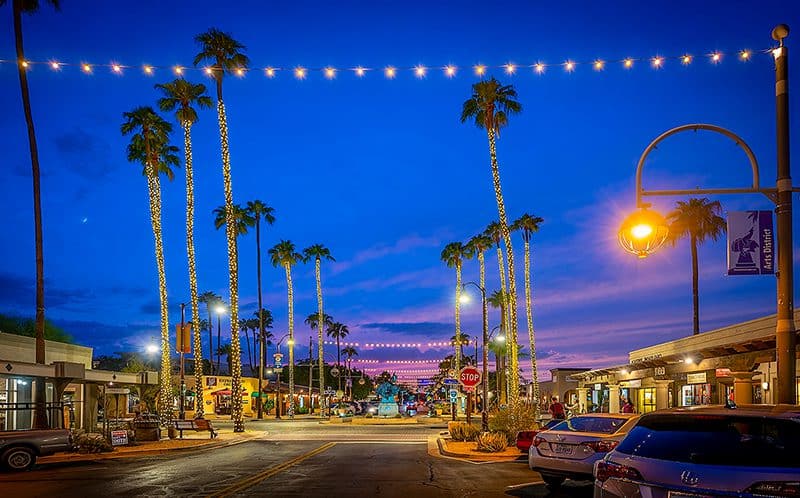 Dusk in a western town with palm trees