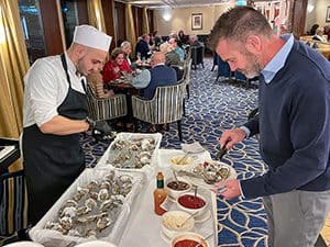 a man selecting oysters on a Tauck river cruise