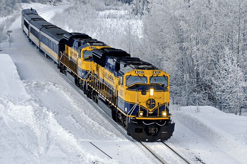 a train in the wilderness during winter in Alaska