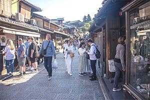 people on a street with old buildings