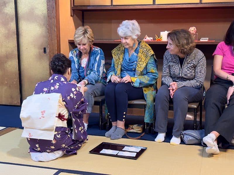 3 women sitting at a tea ceremony