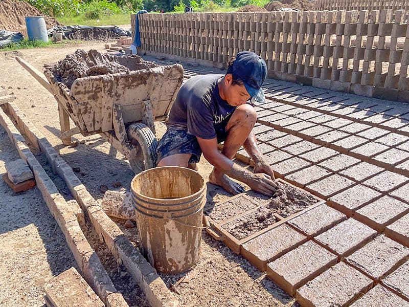 a man making bricks
