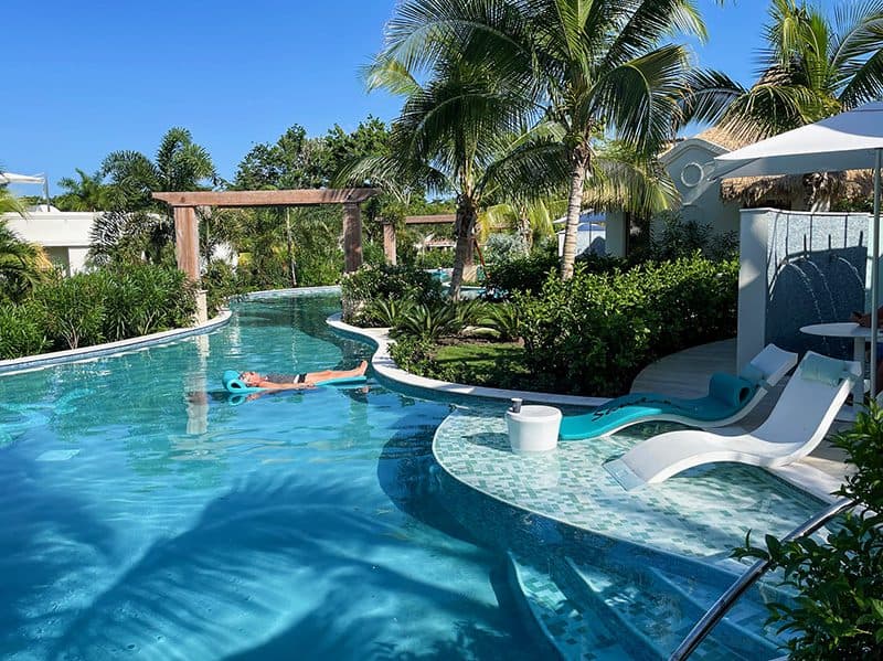 man on a raft in a pool at Sandals Dunns River Resort