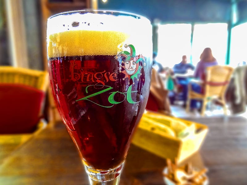 a glass of beer on a table