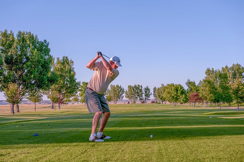 a man laying golf